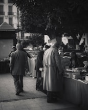A warm community event with people sharing books and smiles outdoors in Tampa.