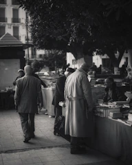 A cozy image showing neighbors exchanging goods with smiles in a friendly setting.