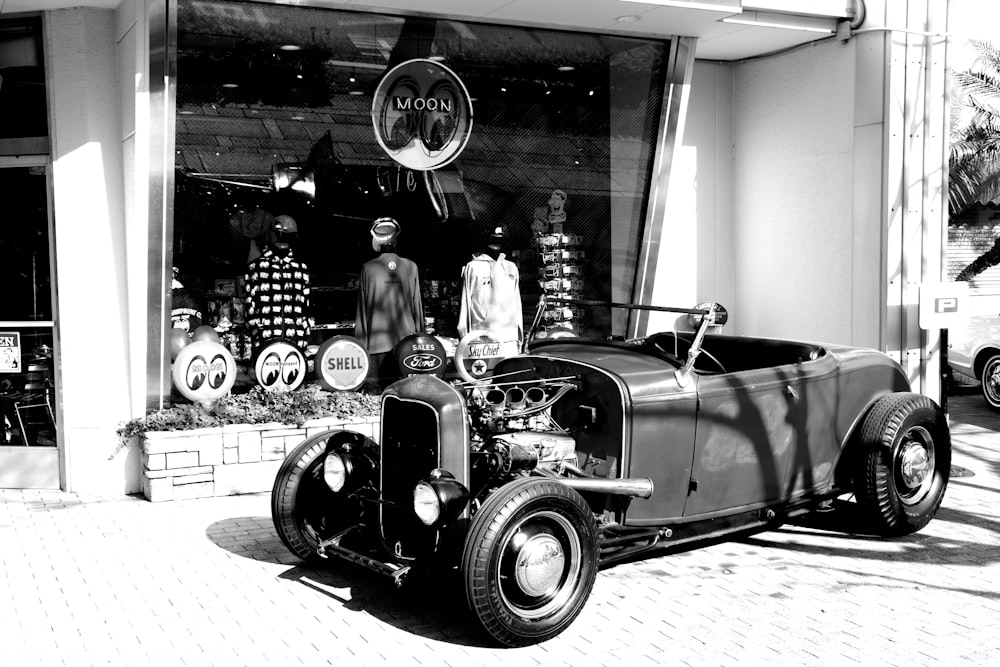 vintage black car in grayscale photography