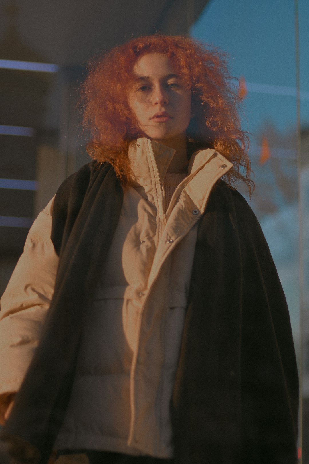 woman in black coat standing