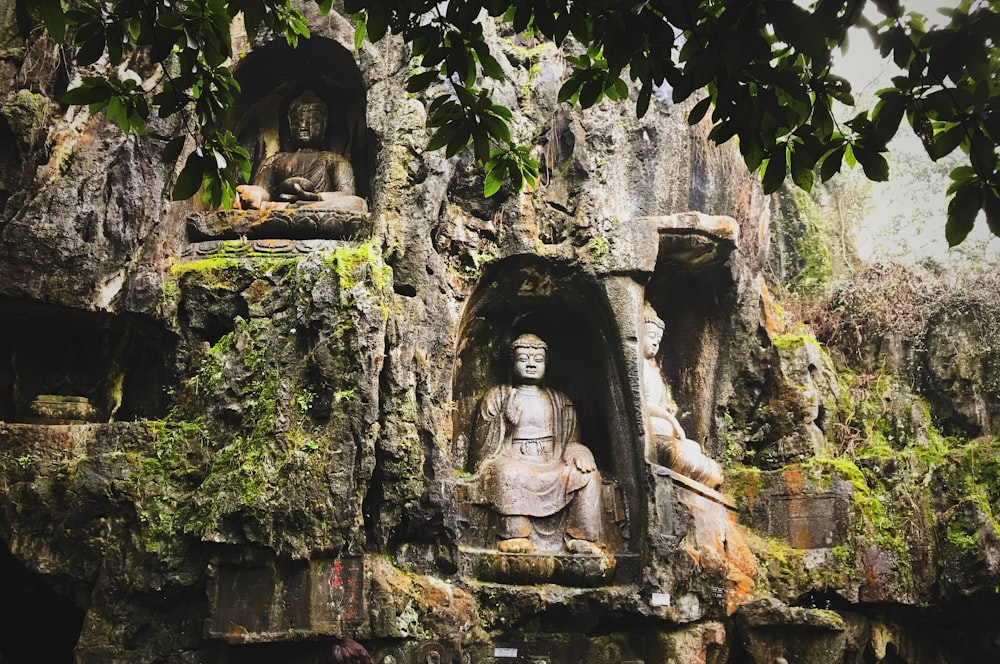 brown concrete statue of man