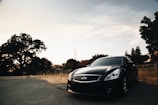 black mercedes benz coupe on road during daytime