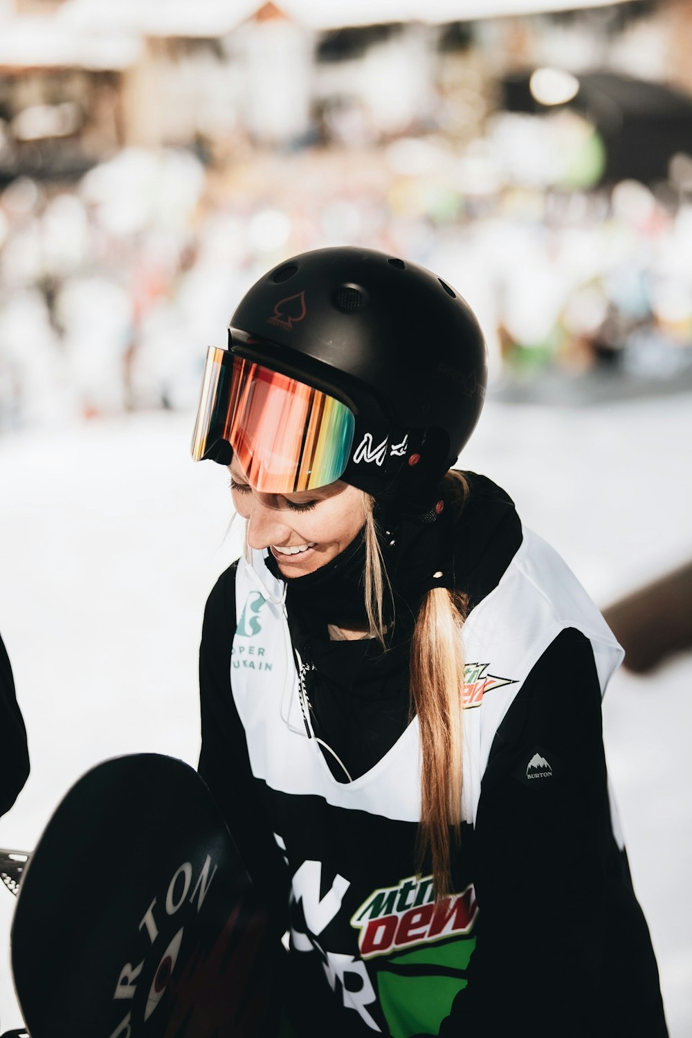 woman in black and white jacket wearing black helmet