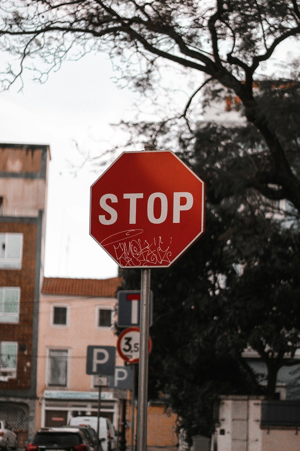 stop sign near brown building