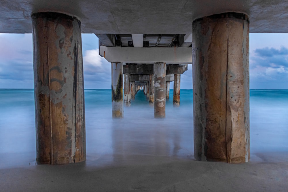 brown wooden dock on sea during daytime