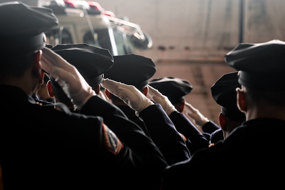 man in black jacket driving car