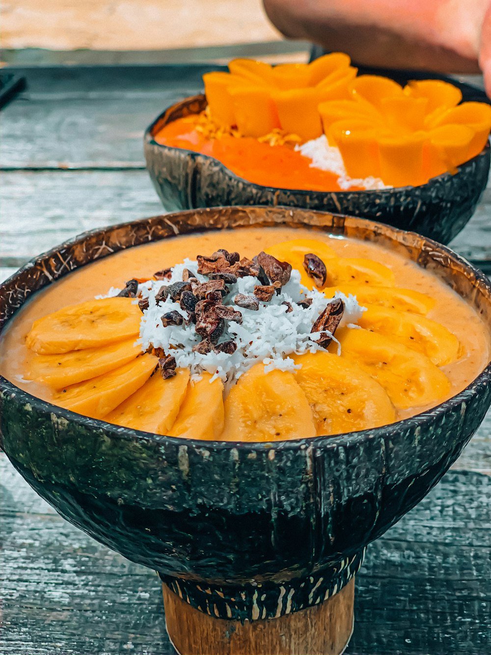 yellow soup in black ceramic bowl