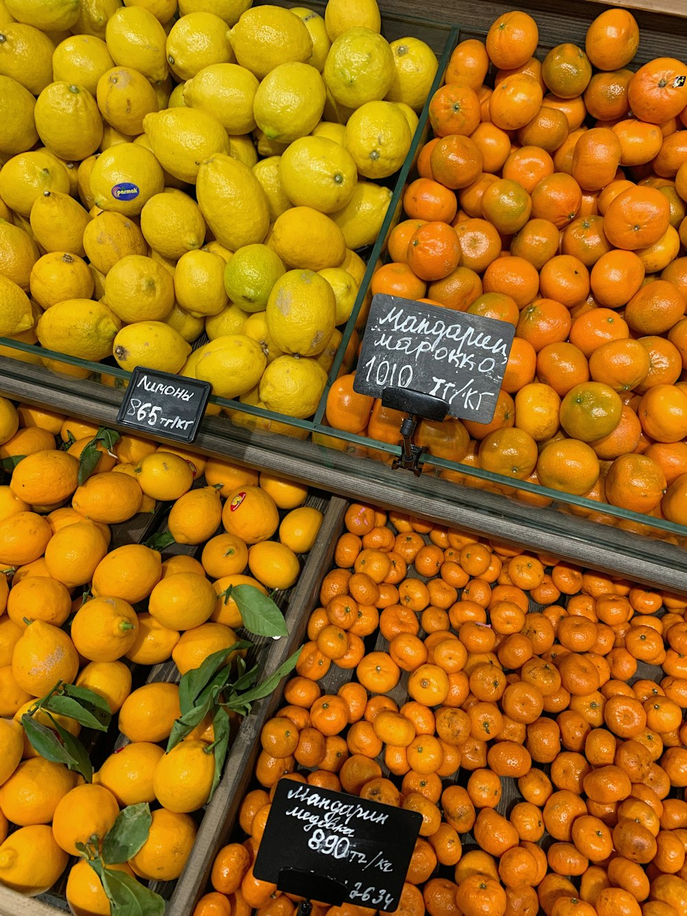 yellow and orange fruits on brown wooden crate