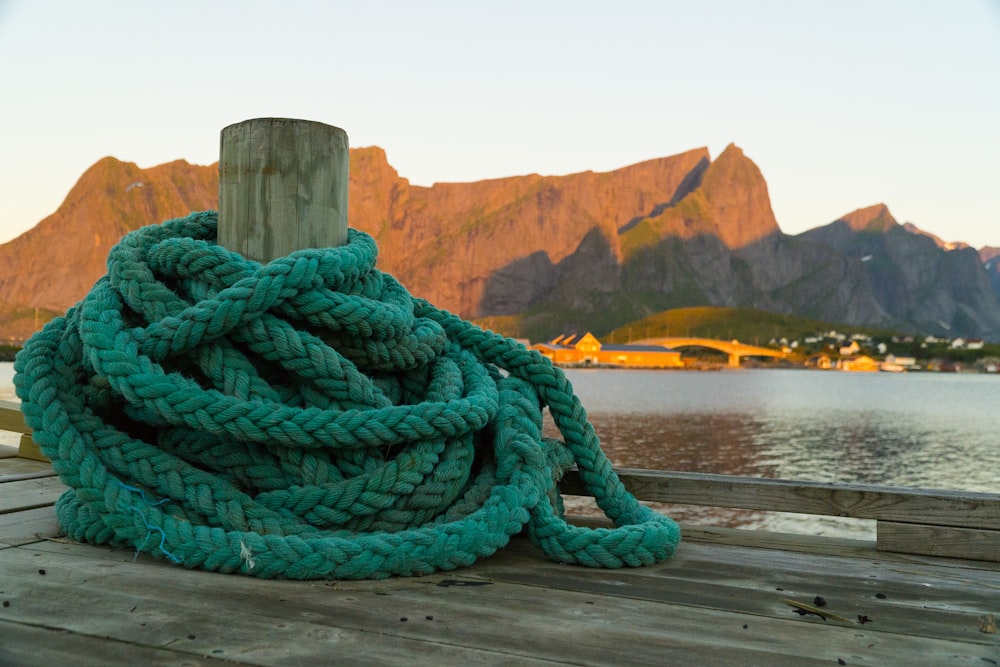 blue rope on brown wooden post