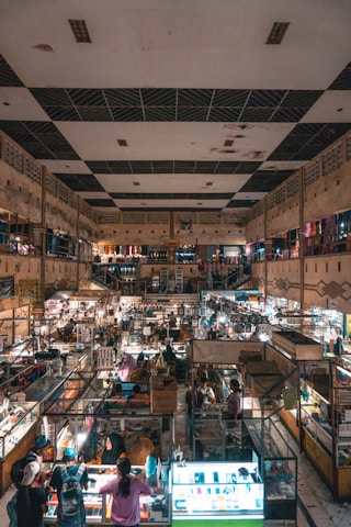 people in store with assorted items