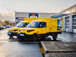 yellow and blue van on road during daytime