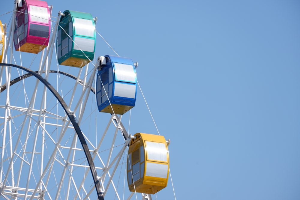 yellow and blue cable cars under blue sky during daytime