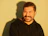 man in black hoodie smiling