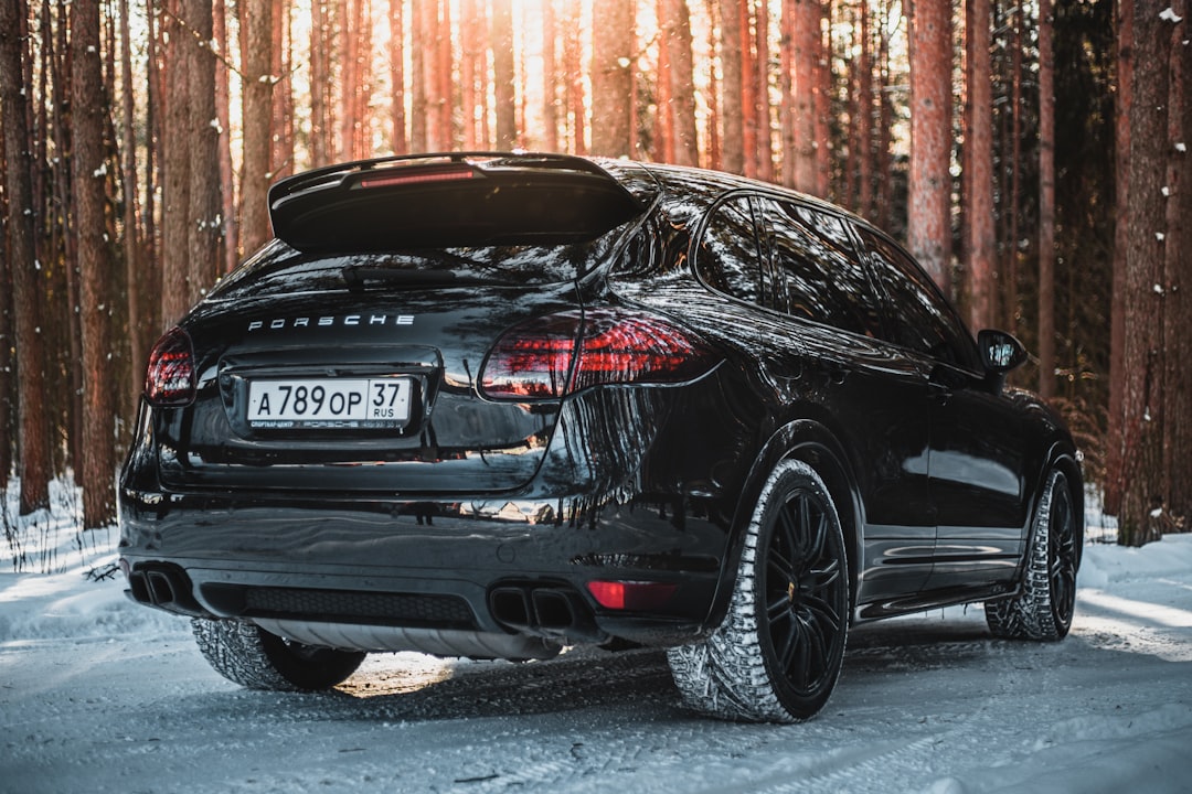 black bmw m 3 coupe parked on snow covered ground