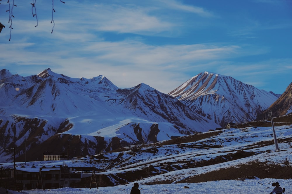 snow covered mountain under cloudy sky during daytime