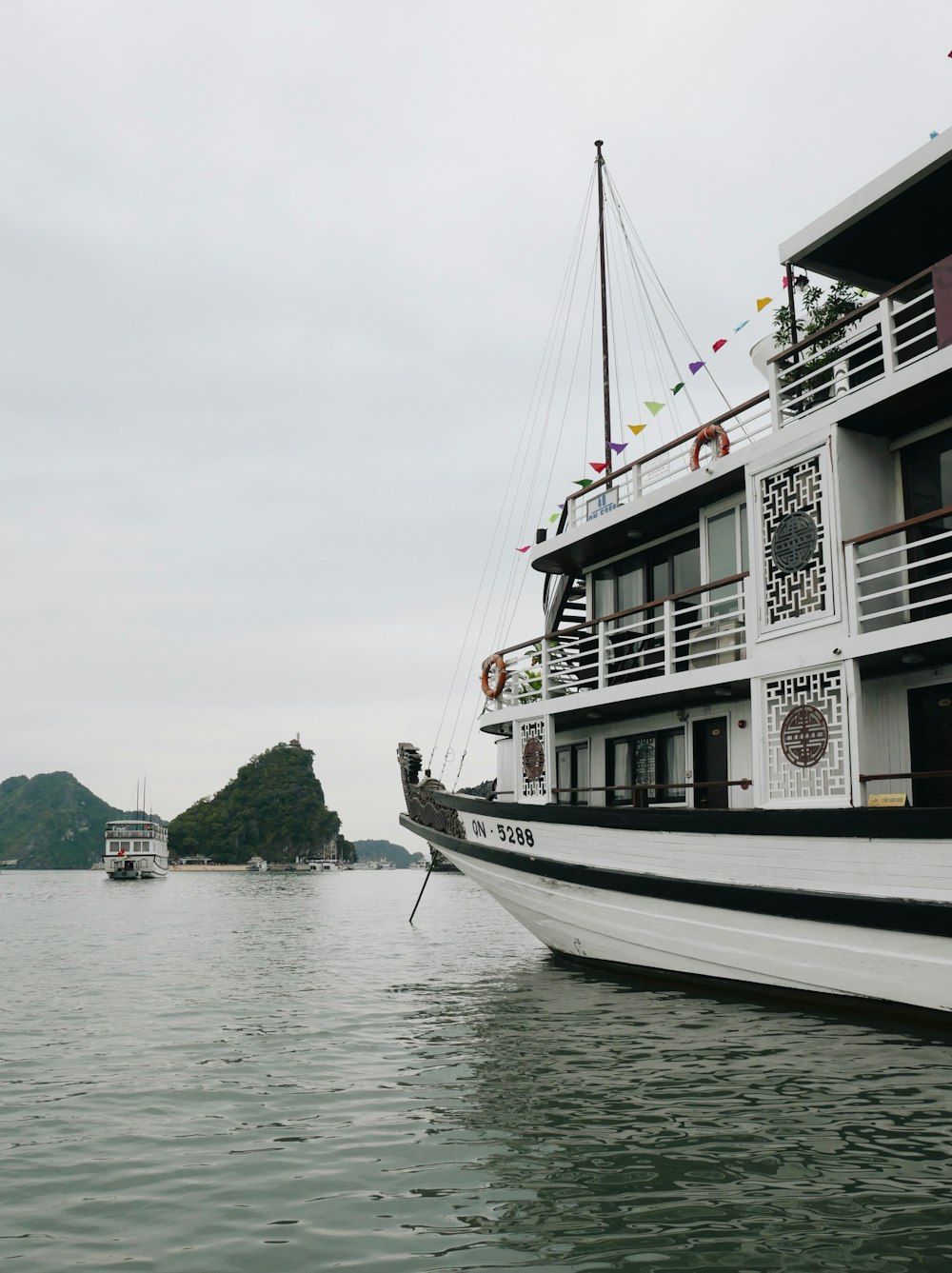 white and black boat on sea during daytime