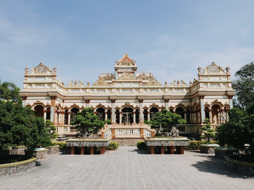 A beautifully designed institutional building with green spaces.