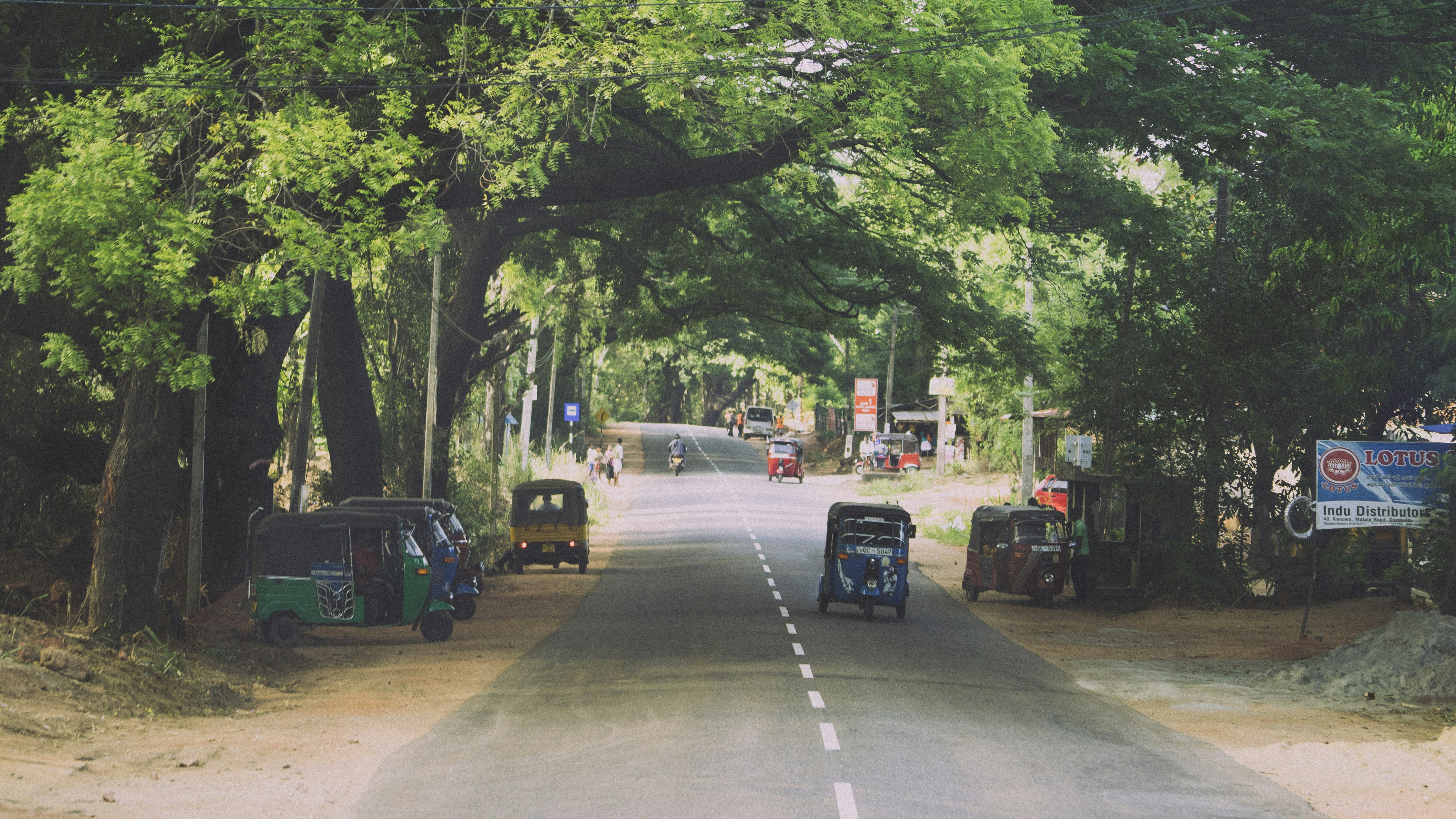 Modern electric SUV driving down a suburban street, representing everyday use of EV SUVs.