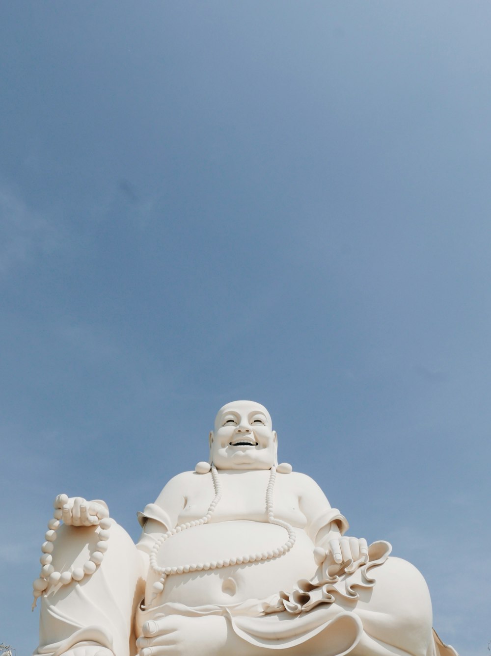 white concrete statue under blue sky during daytime