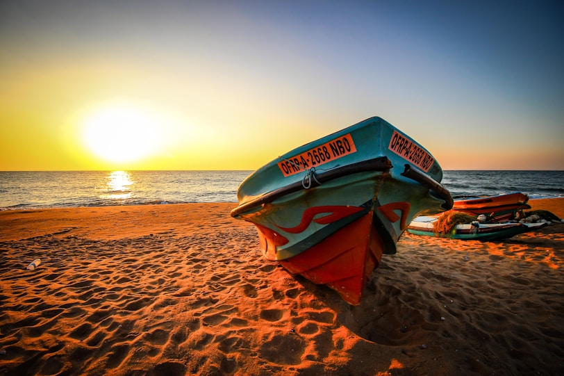 The Hungry Traveller: Spicy Food in Sri lanka boat on brown sand near body of water during sunset