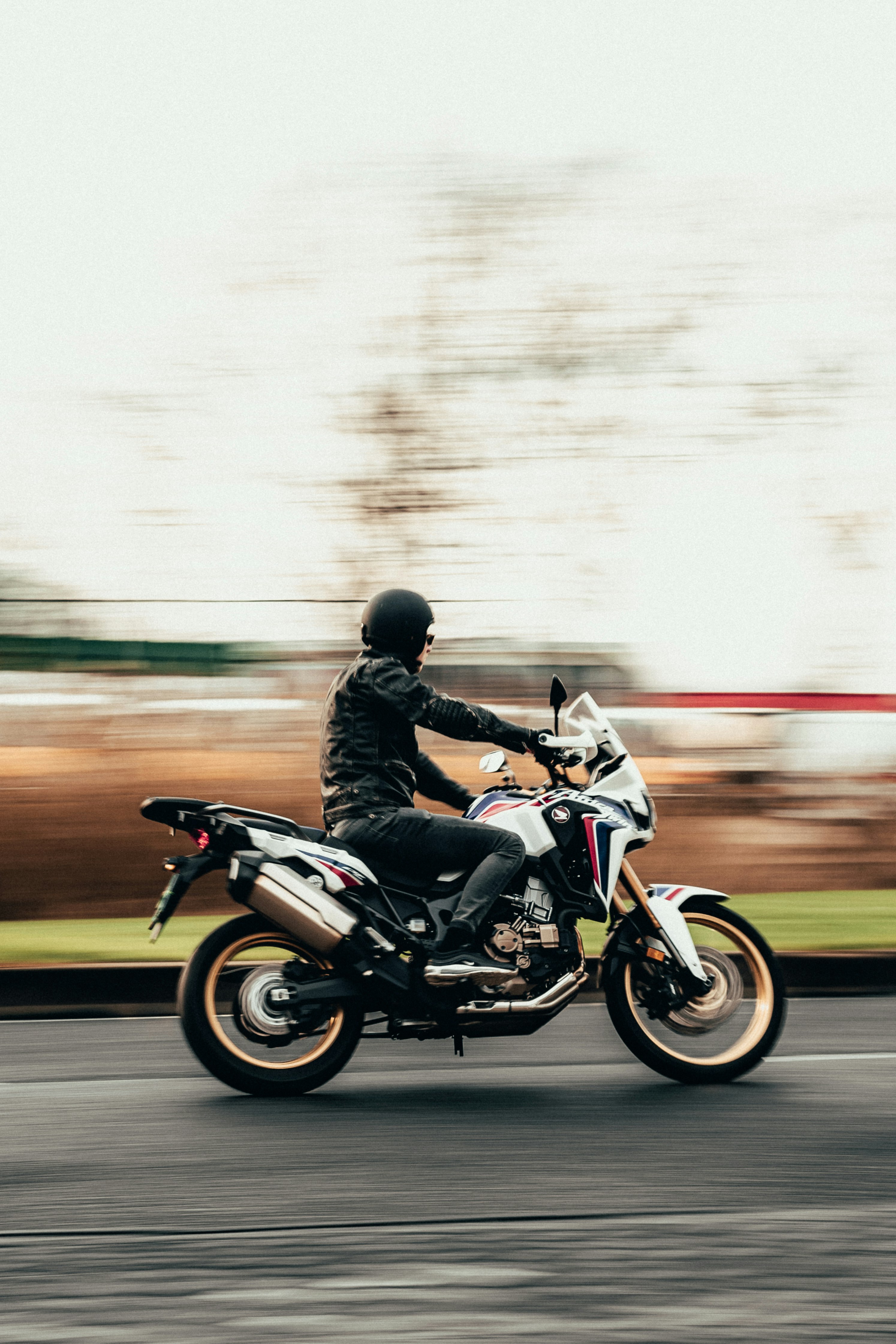 man in black jacket riding motorcycle during daytime