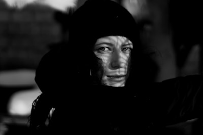 Black and white cinematic shot of Juan Baraza lost in character.