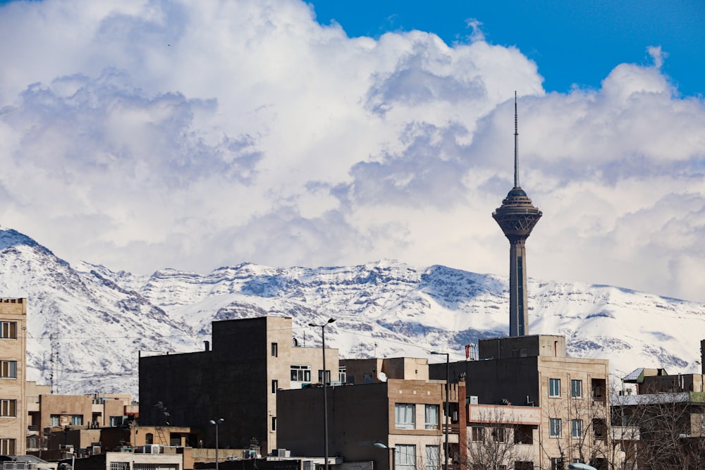 brown concrete building under white clouds and blue sky during daytime