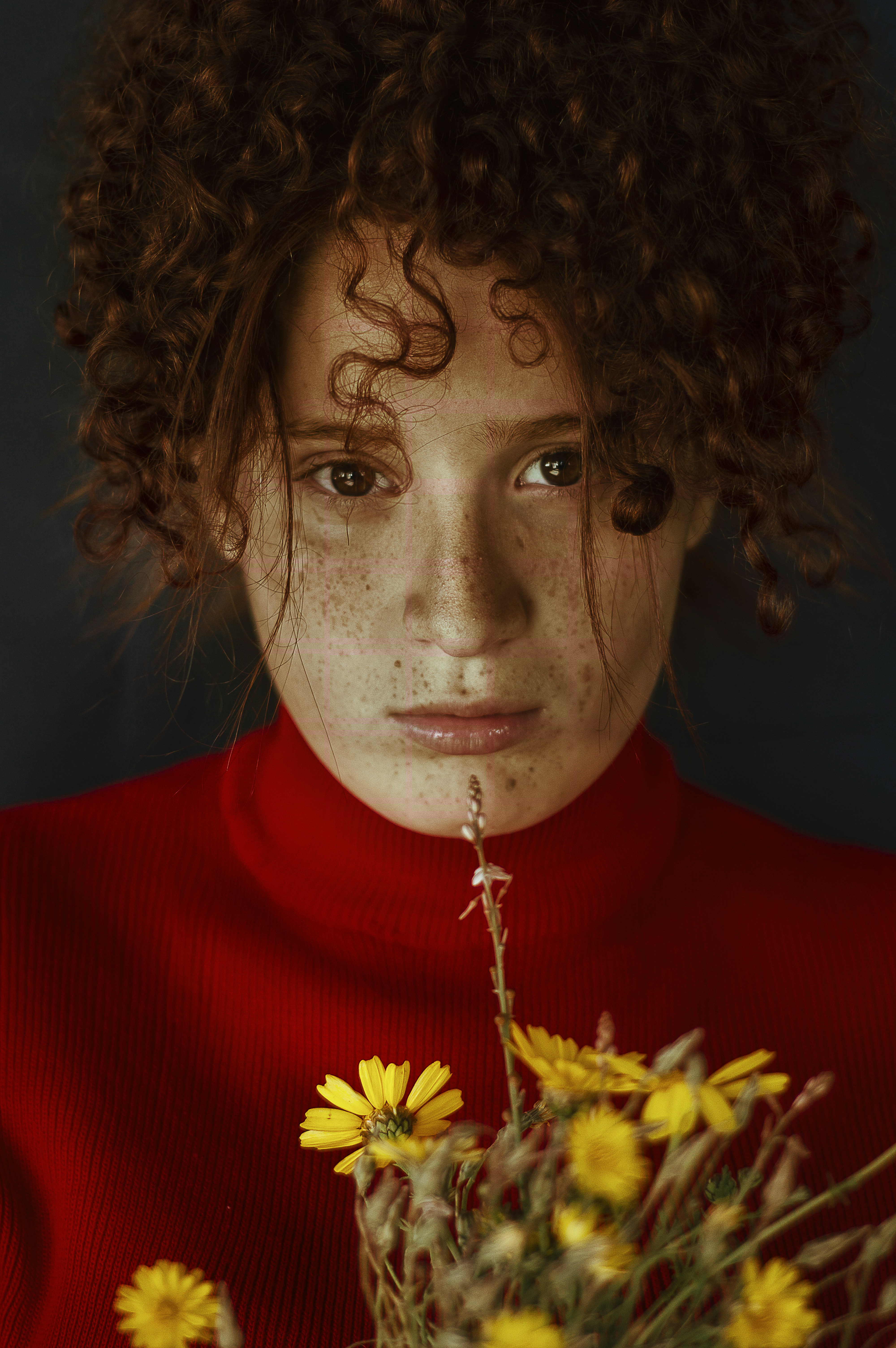 woman in red turtleneck shirt with silver necklace