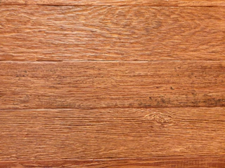 Wallpaper mimicking natural wood texture with warm tones.