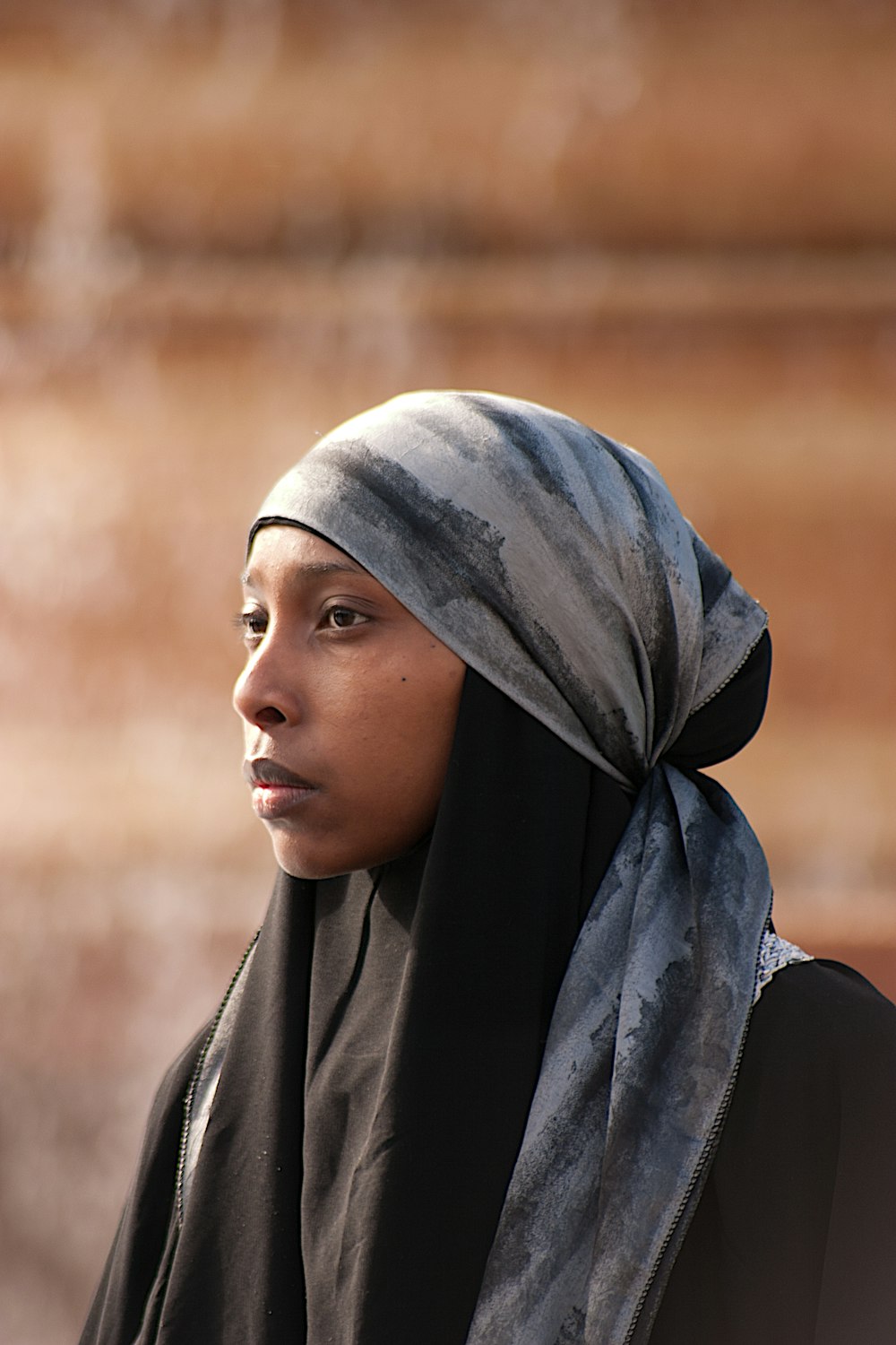 woman in blue hijab in close up photography