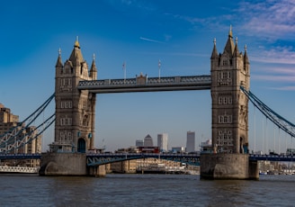 brown concrete bridge under blue sky during daytime