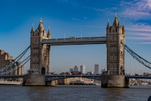 brown concrete bridge under blue sky during daytime