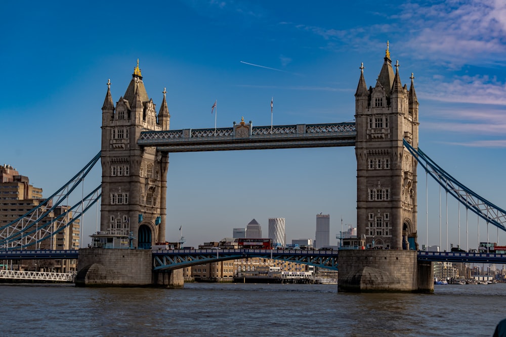 brown concrete bridge under blue sky during daytime