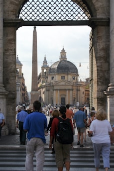 people walking near brown concrete building during daytime