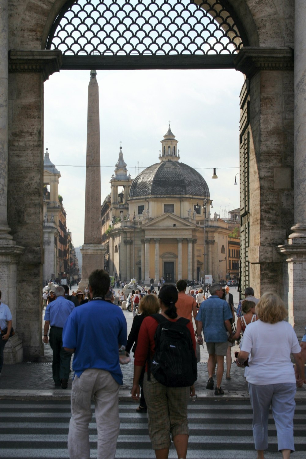 people walking near brown concrete building during daytime