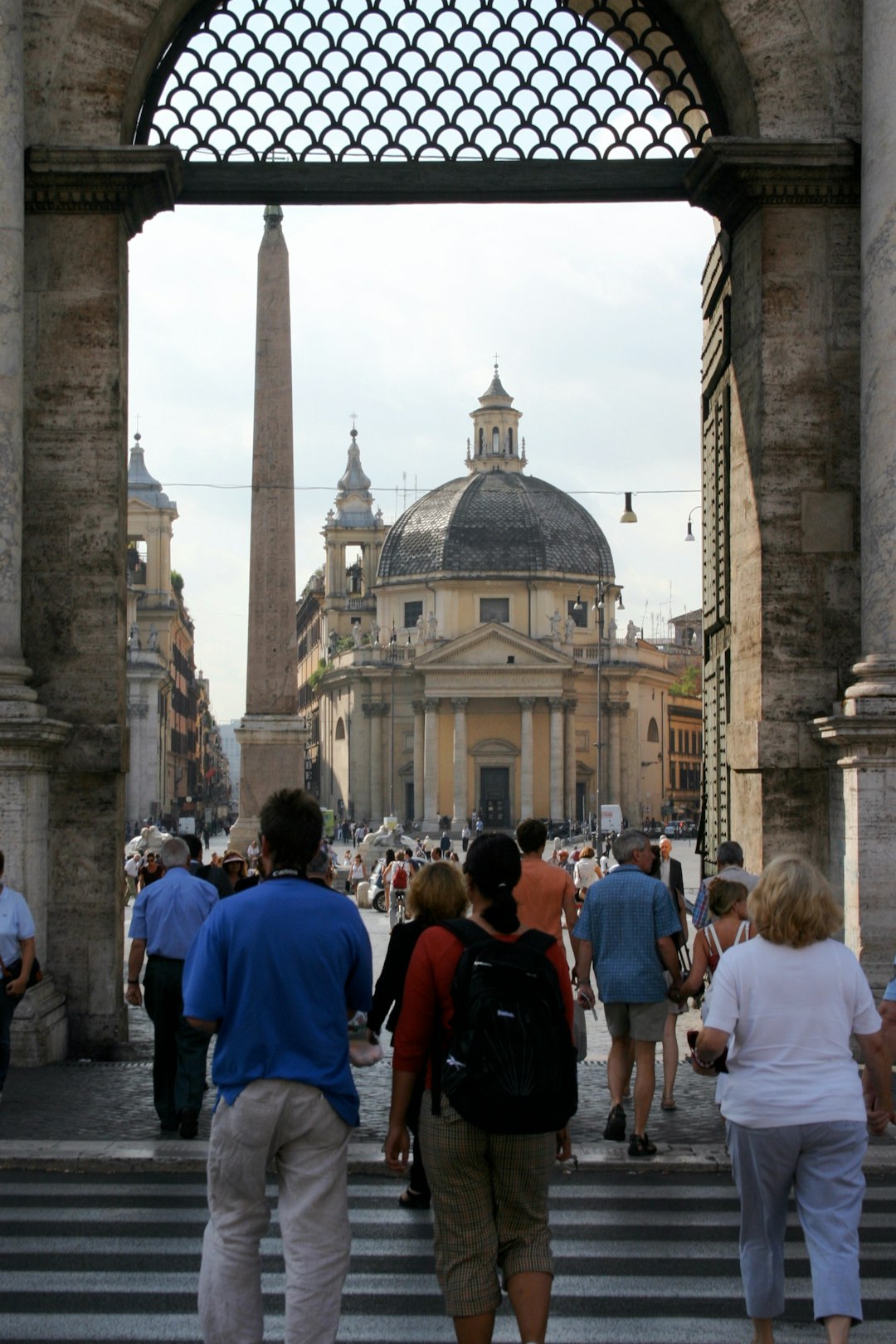 people walking near brown concrete building during daytime