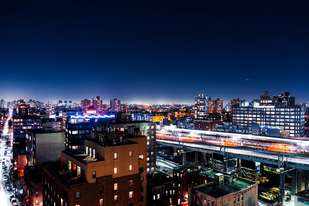 city with high rise buildings during night time