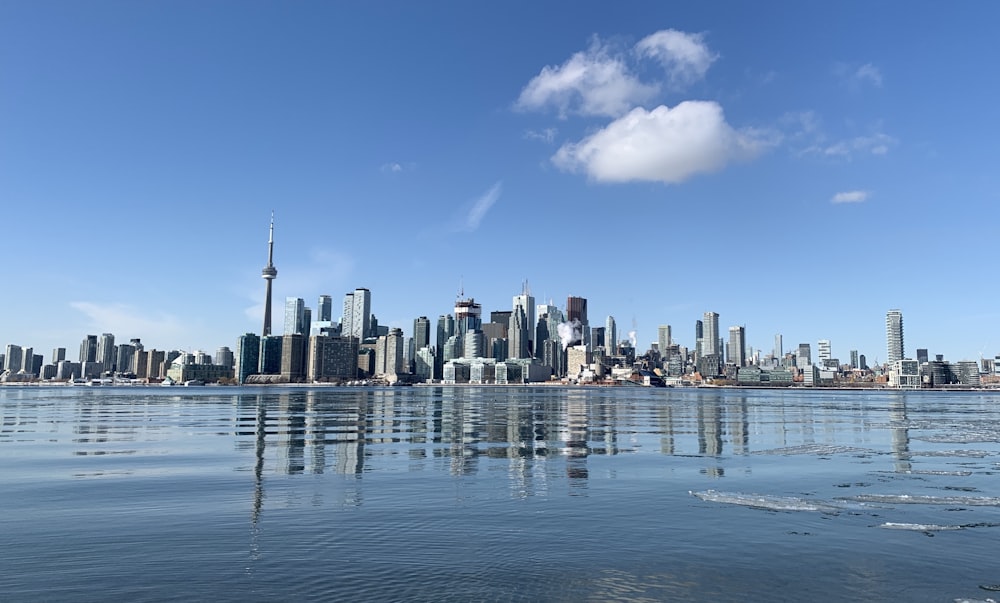 city skyline across body of water during daytime