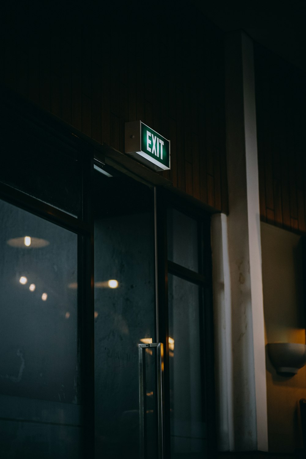 green and white exit sign