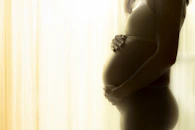 woman in black spaghetti strap top