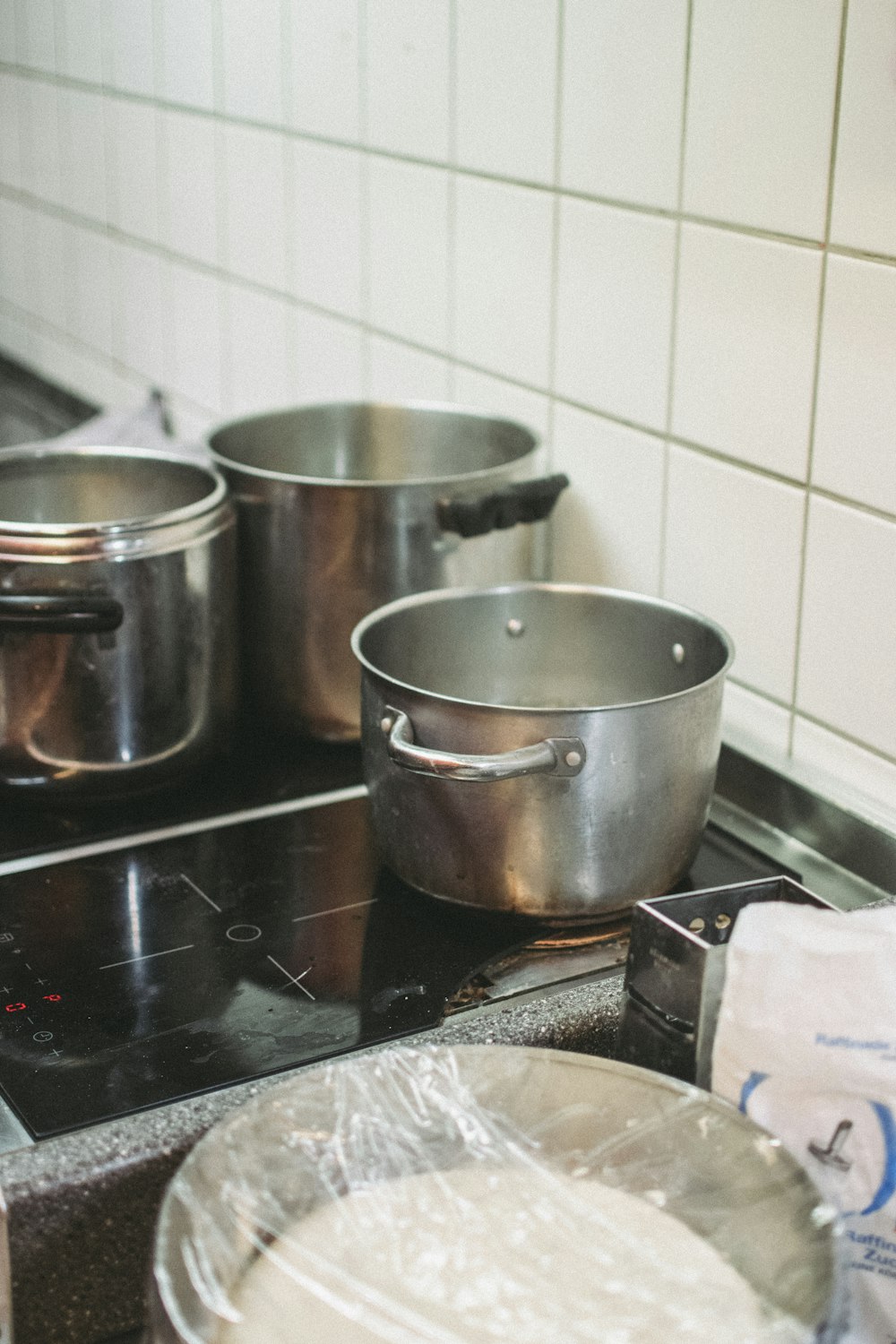 stainless steel cooking pots on stove