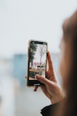 A person using a smartphone outdoors with a clear view.