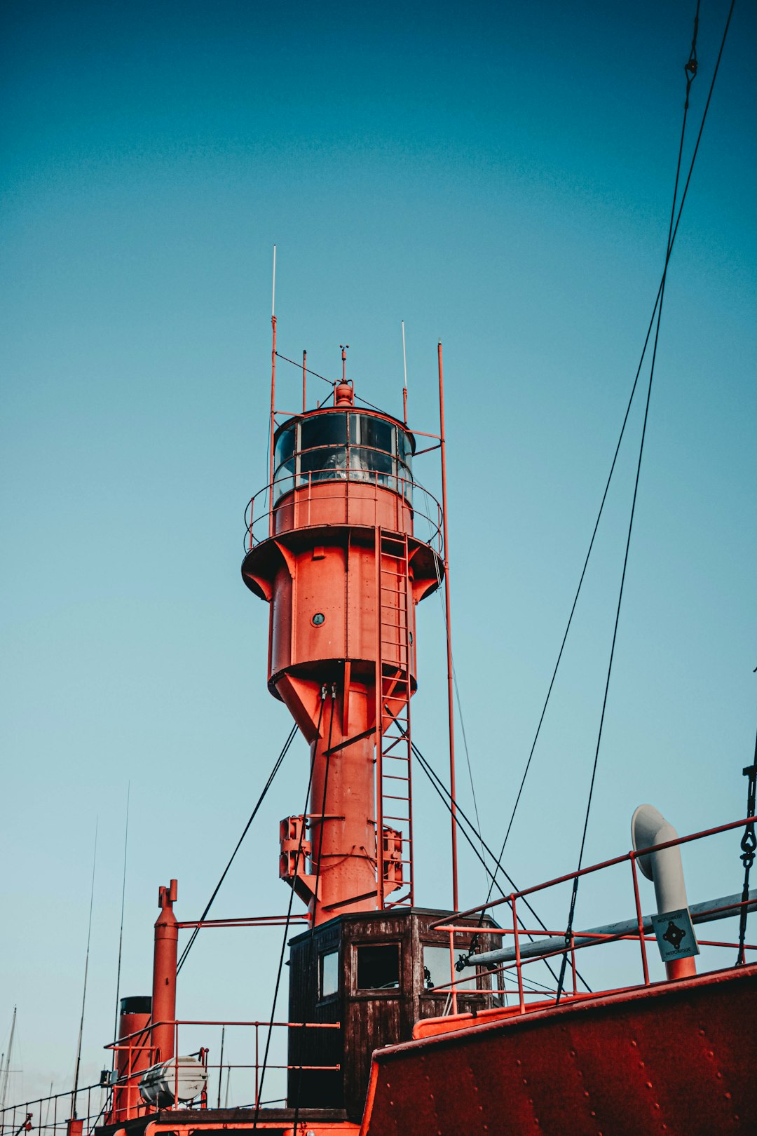 red and white lighthouse under blue sky during daytime