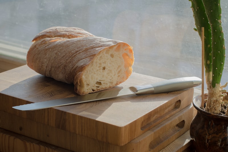 Freshly baked focaccia bread with rosemary on a wooden board