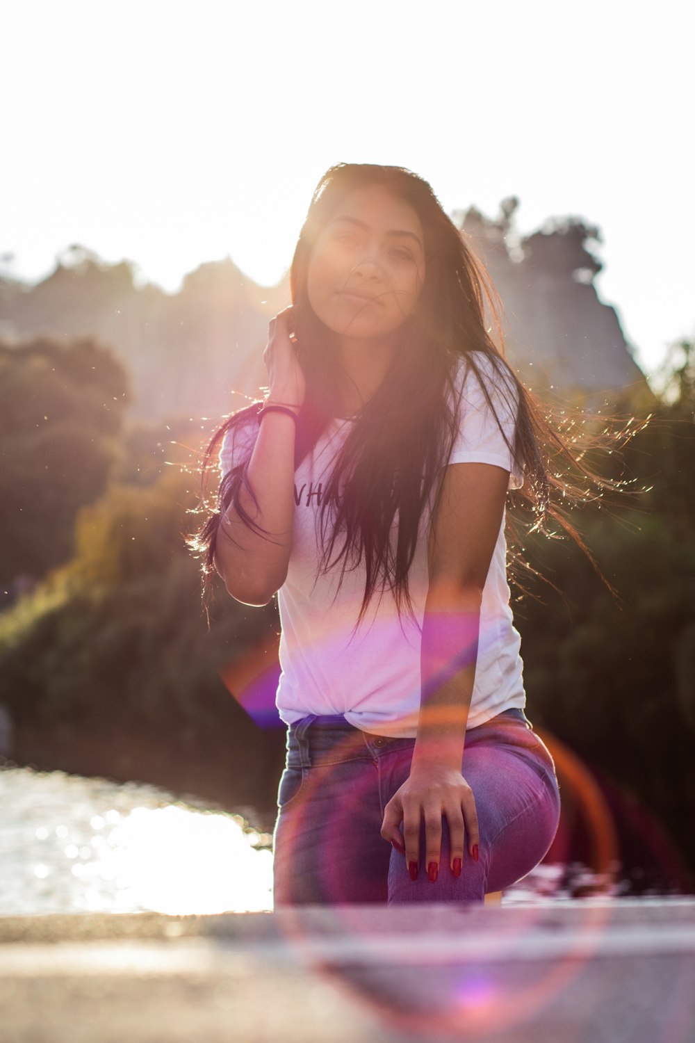 woman in orange and white t-shirt smiling