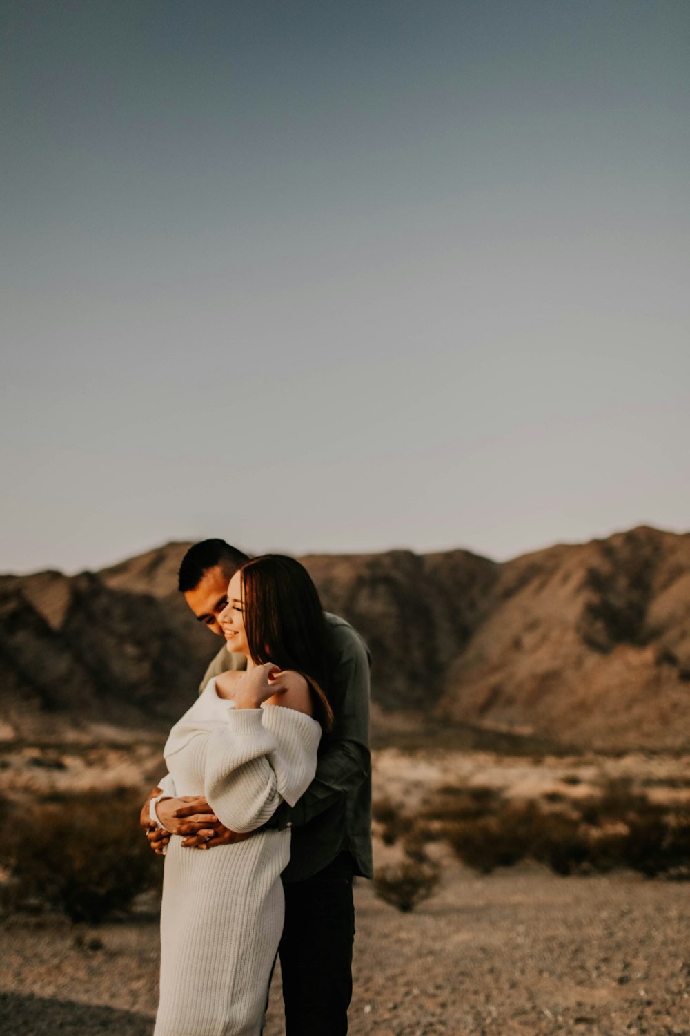 man and woman kissing during daytime