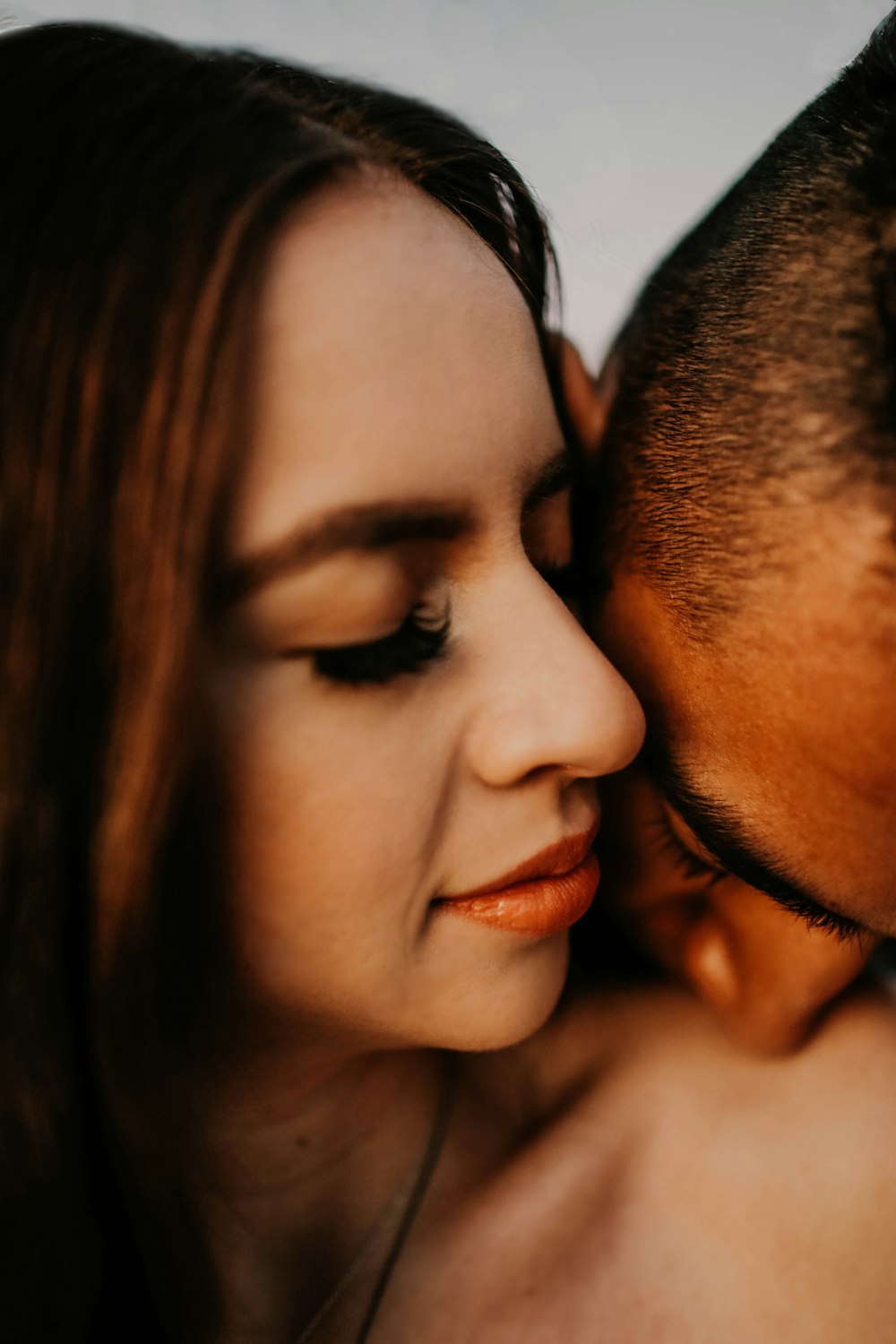 man and woman kissing each other