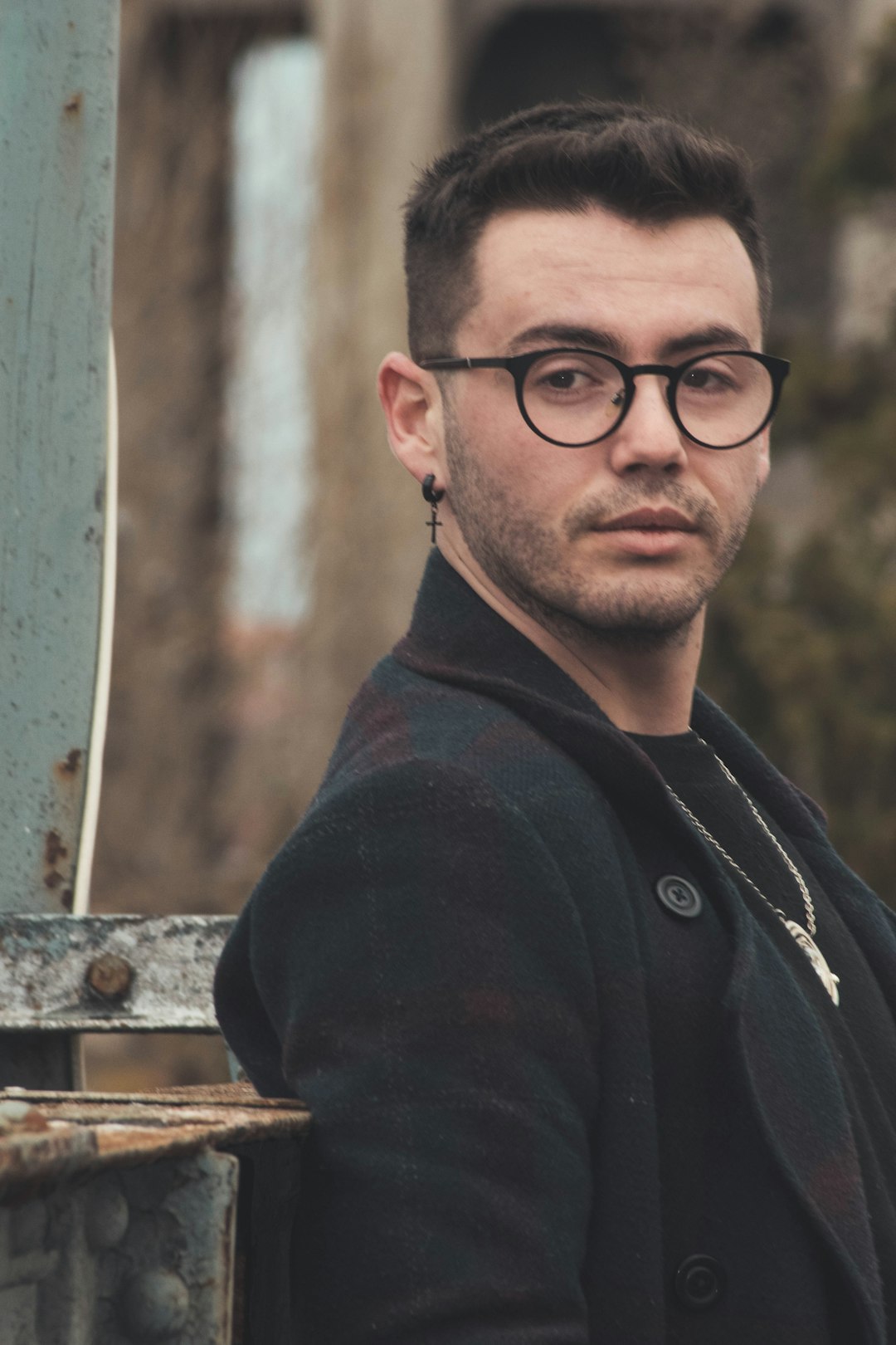 man in black jacket wearing eyeglasses