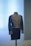 Close-up of a finely embroidered luxury sherwani displayed on a mannequin.