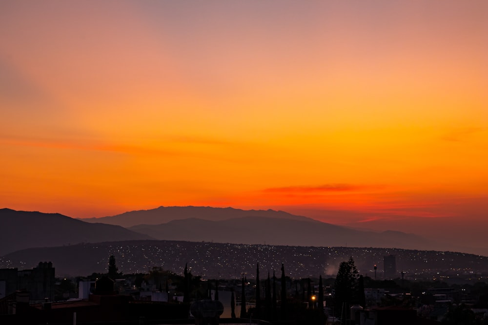 silhouette of mountain during sunset